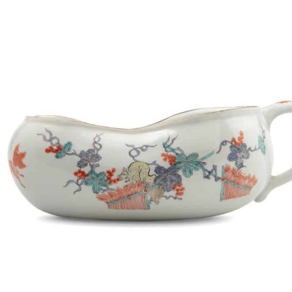 Bourdaloue, or a womens chamber pot. The bourdaloue features a floral pattern against a white background.